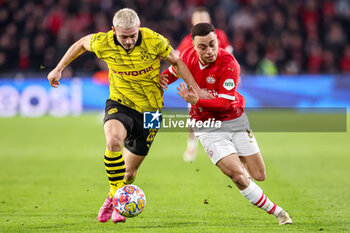 2024-02-20 - Julian Ryerson of Borussia Dortmund, Sergino Dest of PSV during the UEFA Champions League, Round of 16 1st leg football match between PSV and Borussia Dortmund on February 20, 2024 at Philips Stadion in Eindhoven, Netherlands - FOOTBALL - CHAMPIONS LEAGUE - PSV V DORTMUND - UEFA CHAMPIONS LEAGUE - SOCCER