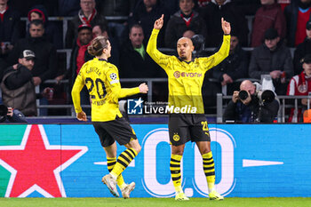 2024-02-20 - Donyell Malen of Borussia Dortmund celebrates his goal 0-1 during the UEFA Champions League, Round of 16 1st leg football match between PSV and Borussia Dortmund on February 20, 2024 at Philips Stadion in Eindhoven, Netherlands - FOOTBALL - CHAMPIONS LEAGUE - PSV V DORTMUND - UEFA CHAMPIONS LEAGUE - SOCCER