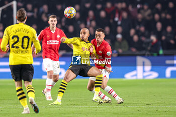 2024-02-20 - Donyell Malen of Borussia Dortmund, Sergino Dest of PSV during the UEFA Champions League, Round of 16 1st leg football match between PSV and Borussia Dortmund on February 20, 2024 at Philips Stadion in Eindhoven, Netherlands - FOOTBALL - CHAMPIONS LEAGUE - PSV V DORTMUND - UEFA CHAMPIONS LEAGUE - SOCCER