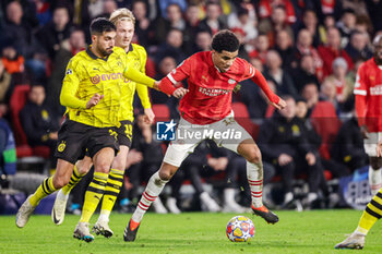 2024-02-20 - Emre Can of Borussia Dortmund battles for possession with Malik Tillman of PSV during the UEFA Champions League, Round of 16 1st leg football match between PSV and Borussia Dortmund on February 20, 2024 at Philips Stadion in Eindhoven, Netherlands - FOOTBALL - CHAMPIONS LEAGUE - PSV V DORTMUND - UEFA CHAMPIONS LEAGUE - SOCCER