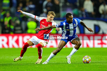 2024-02-21 - Otavio (31) of Porto and Martin Odegaard (8) of Arsenal during the UEFA Champions League, Round of 16 1st leg football match between FC Porto and Arsenal on 21 February 2024 at Estadio do Dragao in Porto, Portugal - FOOTBALL - CHAMPIONS LEAGUE - PORTO V ARSENAL - UEFA CHAMPIONS LEAGUE - SOCCER