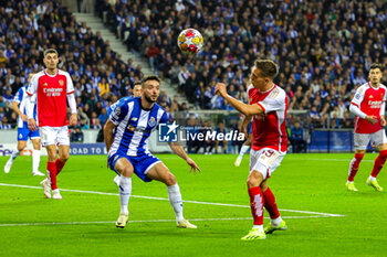 2024-02-21 - Leandro Trossard (19) of Arsenal and Joao Mario of Porto during the UEFA Champions League, Round of 16 1st leg football match between FC Porto and Arsenal on 21 February 2024 at Estadio do Dragao in Porto, Portugal - FOOTBALL - CHAMPIONS LEAGUE - PORTO V ARSENAL - UEFA CHAMPIONS LEAGUE - SOCCER