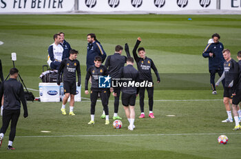 2024-03-05 - Arda Guler (R) higs five to Federico Valverde (L) of Real Madrid during the training of the day before the second leg of the round of 16 football match of Champions League against RB Leipzig at Ciudad Real Madrid in Valdebebas, Madrid. - REAL MADRID VS RB LEIPZIG: REAL MADRID TRAINING AND PRESS CONFERENCE - UEFA CHAMPIONS LEAGUE - SOCCER
