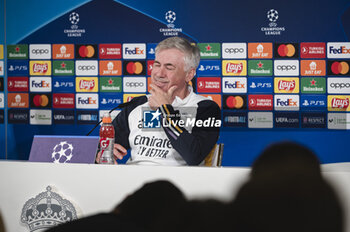 2024-03-05 - Carlo Ancelotti, coach of Real Madrid smiles during the press conference of the day before the second leg of the round of 16 football match of Champions League against RB Leipzig at Ciudad Real Madrid in Valdebebas, Madrid. - REAL MADRID VS RB LEIPZIG: REAL MADRID TRAINING AND PRESS CONFERENCE - UEFA CHAMPIONS LEAGUE - SOCCER