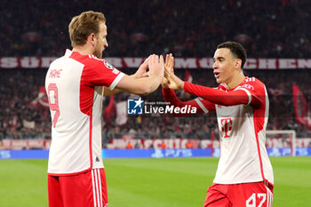 2024-03-05 - Harry Kane of Bayern Munich celebrates his goal 1-0 with Jamal Musiala during the UEFA Champions League, Round of 16, 2nd leg football match between FC Bayern Munich and SS Lazio on March 5, 2024 at Allianz Arena in Munich, Germany - FOOTBALL - CHAMPIONS LEAGUE - BAYERN MUNICH V LAZIO - UEFA CHAMPIONS LEAGUE - SOCCER