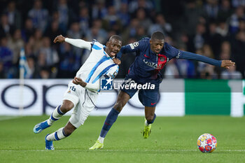 2024-03-05 - Hamari Traore of Real Sociedad competes for the ball with Ousmane Dembele of Paris Saint-Germain during the UEFA Champions League, Round of 16, 2nd leg football match between Real Sociedad and Paris Saint-Germain on March 5, 2024 at Reale Arena in San Sebastian, Spain - FOOTBALL - CHAMPIONS LEAGUE - REAL SOCIEDAD V PARIS SG - UEFA CHAMPIONS LEAGUE - SOCCER