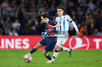 2024-03-05 - Vitinha of Paris Saint-Germain competes for the ball with Ander Barrenetxea of Real Sociedad during the UEFA Champions League, Round of 16, 2nd leg football match between Real Sociedad and Paris Saint-Germain on March 5, 2024 at Reale Arena in San Sebastian, Spain - FOOTBALL - CHAMPIONS LEAGUE - REAL SOCIEDAD V PARIS SG - UEFA CHAMPIONS LEAGUE - SOCCER
