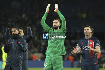 2024-03-05 - Senny Mayulu, PSG goalkeeper Gianluigi Donnarumma, Manuel Ugarte of PSG celebrate the victory following the UEFA Champions League, Round of 16, 2nd leg football match between Real Sociedad and Paris Saint-Germain (PSG) on March 5, 2024 at Reale Arena in San Sebastian, Spain - FOOTBALL - CHAMPIONS LEAGUE - REAL SOCIEDAD V PARIS SG - UEFA CHAMPIONS LEAGUE - SOCCER
