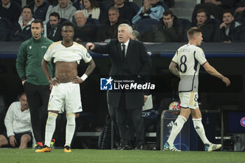 2024-03-06 - Coach of Real Madrid Carlo Ancelotti between Vinicius Jr and Toni Kroos of Real Madrid during the UEFA Champions League, Round of 16, 2nd leg football match between Real Madrid and RB Leipzig on March 6, 2024 at Santiago Bernabeu stadium in Madrid, Spain - FOOTBALL - CHAMPIONS LEAGUE - REAL MADRID V RB LEIPZIG - UEFA CHAMPIONS LEAGUE - SOCCER