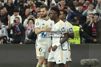2024-03-06 - Vinicius Jr of Real Madrid celebrates his goal with Nacho Fernandez (left) during the UEFA Champions League, Round of 16, 2nd leg football match between Real Madrid and RB Leipzig on March 6, 2024 at Santiago Bernabeu stadium in Madrid, Spain - FOOTBALL - CHAMPIONS LEAGUE - REAL MADRID V RB LEIPZIG - UEFA CHAMPIONS LEAGUE - SOCCER