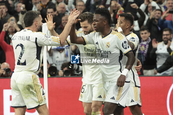 2024-03-06 - Vinicius Jr of Real Madrid celebrates his goal with Daniel Carvajal, Nacho Fernandez during the UEFA Champions League, Round of 16, 2nd leg football match between Real Madrid and RB Leipzig on March 6, 2024 at Santiago Bernabeu stadium in Madrid, Spain - FOOTBALL - CHAMPIONS LEAGUE - REAL MADRID V RB LEIPZIG - UEFA CHAMPIONS LEAGUE - SOCCER