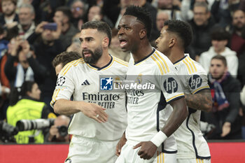 2024-03-06 - Vinicius Jr of Real Madrid celebrates his goal with Daniel Carvajal, Rodrygo during the UEFA Champions League, Round of 16, 2nd leg football match between Real Madrid and RB Leipzig on March 6, 2024 at Santiago Bernabeu stadium in Madrid, Spain - FOOTBALL - CHAMPIONS LEAGUE - REAL MADRID V RB LEIPZIG - UEFA CHAMPIONS LEAGUE - SOCCER