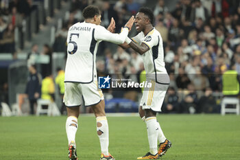 2024-03-06 - Vinicius Jr of Real Madrid celebrates his goal with Jude Bellingham (left) during the UEFA Champions League, Round of 16, 2nd leg football match between Real Madrid and RB Leipzig on March 6, 2024 at Santiago Bernabeu stadium in Madrid, Spain - FOOTBALL - CHAMPIONS LEAGUE - REAL MADRID V RB LEIPZIG - UEFA CHAMPIONS LEAGUE - SOCCER