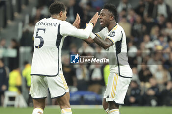 2024-03-06 - Vinicius Jr of Real Madrid celebrates his goal with Jude Bellingham (left) during the UEFA Champions League, Round of 16, 2nd leg football match between Real Madrid and RB Leipzig on March 6, 2024 at Santiago Bernabeu stadium in Madrid, Spain - FOOTBALL - CHAMPIONS LEAGUE - REAL MADRID V RB LEIPZIG - UEFA CHAMPIONS LEAGUE - SOCCER