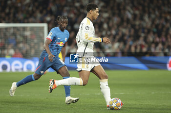 2024-03-06 - Jude Bellingham of Real Madrid, left Amadou Haidara of RB Leipzig during the UEFA Champions League, Round of 16, 2nd leg football match between Real Madrid and RB Leipzig on March 6, 2024 at Santiago Bernabeu stadium in Madrid, Spain - FOOTBALL - CHAMPIONS LEAGUE - REAL MADRID V RB LEIPZIG - UEFA CHAMPIONS LEAGUE - SOCCER