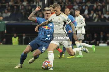 2024-03-06 - Toni Kroos of Real Madrid, left Benjamin Sesko of RB Leipzig during the UEFA Champions League, Round of 16, 2nd leg football match between Real Madrid and RB Leipzig on March 6, 2024 at Santiago Bernabeu stadium in Madrid, Spain - FOOTBALL - CHAMPIONS LEAGUE - REAL MADRID V RB LEIPZIG - UEFA CHAMPIONS LEAGUE - SOCCER