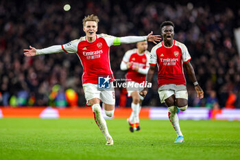 2024-03-13 - Arsenal win 4-2 on penalties and Martin Odegaard (8) of Arsenal celebrates during the UEFA Champions League, Round of 16, 2nd leg football match between Arsenal and FC Porto on 12 March 2024 at the Emirates Stadium in London, England - FOOTBALL - CHAMPIONS LEAGUE - ARSENAL V PORTO - UEFA CHAMPIONS LEAGUE - SOCCER