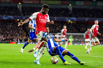 2024-03-13 - Bukayo Saka (7) of Arsenal and Wilson Manafa (18) of FC Porto during the UEFA Champions League, Round of 16, 2nd leg football match between Arsenal and FC Porto on 12 March 2024 at the Emirates Stadium in London, England - FOOTBALL - CHAMPIONS LEAGUE - ARSENAL V PORTO - UEFA CHAMPIONS LEAGUE - SOCCER