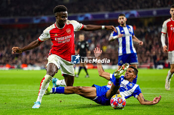 2024-03-13 - Bukayo Saka (7) of Arsenal tussles with Galeno (13) of FC Porto during the UEFA Champions League, Round of 16, 2nd leg football match between Arsenal and FC Porto on 12 March 2024 at the Emirates Stadium in London, England - FOOTBALL - CHAMPIONS LEAGUE - ARSENAL V PORTO - UEFA CHAMPIONS LEAGUE - SOCCER