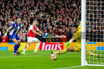 2024-03-13 - Leandro Trossard (19) of Arsenal scores a goal 1-0, Pepe of FC Porto during the UEFA Champions League, Round of 16, 2nd leg football match between Arsenal and FC Porto on 12 March 2024 at the Emirates Stadium in London, England - FOOTBALL - CHAMPIONS LEAGUE - ARSENAL V PORTO - UEFA CHAMPIONS LEAGUE - SOCCER