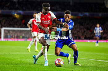 2024-03-13 - Bukayo Saka (7) of Arsenal battles with Wilson Manafa (18) of FC Porto during the UEFA Champions League, Round of 16, 2nd leg football match between Arsenal and FC Porto on 12 March 2024 at the Emirates Stadium in London, England - FOOTBALL - CHAMPIONS LEAGUE - ARSENAL V PORTO - UEFA CHAMPIONS LEAGUE - SOCCER