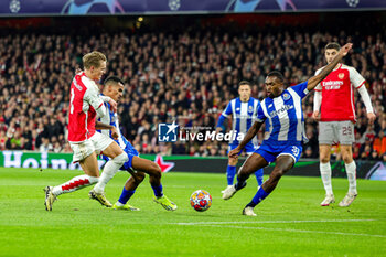 2024-03-13 - Martin Odegaard (8) of Arsenal and Galeno (13), Otavio Ataide (31) of FC Porto during the UEFA Champions League, Round of 16, 2nd leg football match between Arsenal and FC Porto on 12 March 2024 at the Emirates Stadium in London, England - FOOTBALL - CHAMPIONS LEAGUE - ARSENAL V PORTO - UEFA CHAMPIONS LEAGUE - SOCCER