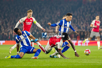 2024-03-13 - Galeno (13) of FC Porto brings down Bukayo Saka (7) of Arsenal during the UEFA Champions League, Round of 16, 2nd leg football match between Arsenal and FC Porto on 12 March 2024 at the Emirates Stadium in London, England - FOOTBALL - CHAMPIONS LEAGUE - ARSENAL V PORTO - UEFA CHAMPIONS LEAGUE - SOCCER