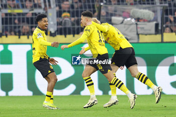 2024-03-13 - Jadon Sancho of Borussia Dortmund celebrates his goal 1-0 with Donyell Malen, Julian Brandt during the UEFA Champions League, Round of 16, 2nd leg football match between Borussia Dortmund and PSV Eindhoven on March 13, 2024 at Signal Iduna Park in Dortmund, Germany - FOOTBALL - CHAMPIONS LEAGUE - DORTMUND V PSV - UEFA CHAMPIONS LEAGUE - SOCCER