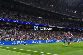 2024-04-09 - Bernardo Silva of Manchester City (L) celebrates a goal during the UEFA Champions League quarter-final first leg match between Real Madrid CF and Manchester City at Estadio Santiago Bernabeu on April 9, 2024 in Madrid, Spain. - REAL MADRID VS MANCHESTER CITY - UEFA CHAMPIONS LEAGUE - SOCCER