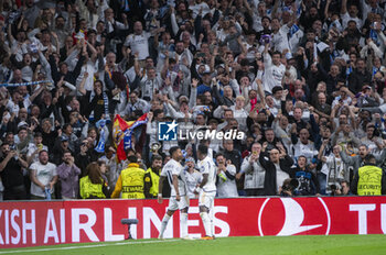 2024-04-09 - Rodrygo Silva de Goes of Real Madrid (L) and Vinicius Junior of Real Madrid celebrate a goal during the UEFA Champions League quarter-final first leg match between Real Madrid CF and Manchester City at Estadio Santiago Bernabeu on April 9, 2024 in Madrid, Spain. - REAL MADRID VS MANCHESTER CITY - UEFA CHAMPIONS LEAGUE - SOCCER