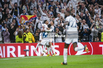 2024-04-09 - Rodrygo Silva de Goes (L), Vinicius Junior (C), Jude Bellingham (R) of Real Madrid celebrate a goal during the UEFA Champions League quarter-final first leg match between Real Madrid CF and Manchester City at Estadio Santiago Bernabeu on April 9, 2024 in Madrid, Spain. - REAL MADRID VS MANCHESTER CITY - UEFA CHAMPIONS LEAGUE - SOCCER