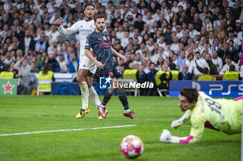 2024-04-09 - Jude Bellingham of Real Madrid (L) takes a shoot against Bernardo Silva (C) and Stefan Ortega Moreno (R) of Manchester City during the UEFA Champions League quarter-final first leg match between Real Madrid CF and Manchester City at Estadio Santiago Bernabeu on April 9, 2024 in Madrid, Spain. - REAL MADRID VS MANCHESTER CITY - UEFA CHAMPIONS LEAGUE - SOCCER