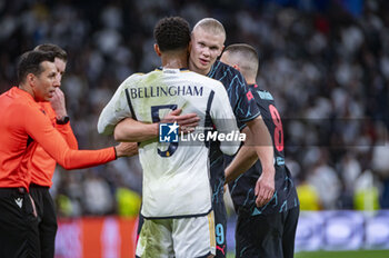 2024-04-09 - Jude Bellingham of Real Madrid (L) hugs Erling Haaland of Manchester City (R) during the UEFA Champions League quarter-final first leg match between Real Madrid CF and Manchester City at Estadio Santiago Bernabeu on April 9, 2024 in Madrid, Spain. - REAL MADRID VS MANCHESTER CITY - UEFA CHAMPIONS LEAGUE - SOCCER
