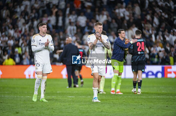 2024-04-09 - Federico Valverde (L) and Toni Kroos (R) of Real Madrid during the UEFA Champions League quarter-final first leg match between Real Madrid CF and Manchester City at Estadio Santiago Bernabeu on April 9, 2024 in Madrid, Spain. - REAL MADRID VS MANCHESTER CITY - UEFA CHAMPIONS LEAGUE - SOCCER