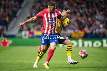 2024-04-10 - Jorge Resurreccion Merodio (Koke) of Atletico Madrid (L) seen in action against Jadon Sancho of Borussia Dortmund (R) during the UEFA Champions League quarter-final first leg match between Atletico Madrid and Borussia Dortmund at Estadio Civitas Metropolitano on April 10, 2024 in Madrid, Spain. - ATLETICO MADRID VS BORUSSIA DORTMUND - UEFA CHAMPIONS LEAGUE - SOCCER