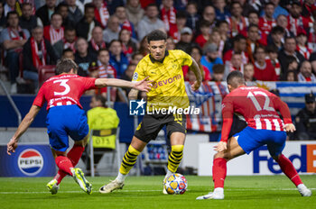 2024-04-10 - Jadon Sancho of Borussia Dortmund seen in action with the ball during the UEFA Champions League quarter-final first leg match between Atletico Madrid and Borussia Dortmund at Estadio Civitas Metropolitano on April 10, 2024 in Madrid, Spain. - ATLETICO MADRID VS BORUSSIA DORTMUND - UEFA CHAMPIONS LEAGUE - SOCCER