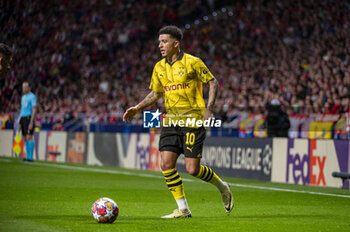 2024-04-10 - Jadon Sancho of Borussia Dortmund seen in action with the ball during the UEFA Champions League quarter-final first leg match between Atletico Madrid and Borussia Dortmund at Estadio Civitas Metropolitano on April 10, 2024 in Madrid, Spain. - ATLETICO MADRID VS BORUSSIA DORTMUND - UEFA CHAMPIONS LEAGUE - SOCCER
