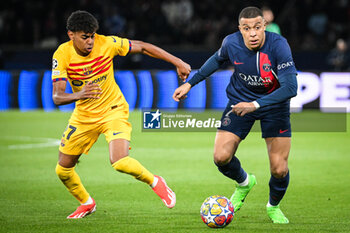 2024-04-10 - Lamine YAMAL of Barcelona and Kylian MBAPPE of PSG during the UEFA Champions League, Quarter-finals, 1st leg football match between Paris Saint-Germain and FC Barcelona on April 10, 2024 at Parc des Princes stadium in Paris, France - FOOTBALL - CHAMPIONS LEAGUE - PARIS SG V FC BARCELONA - UEFA CHAMPIONS LEAGUE - SOCCER