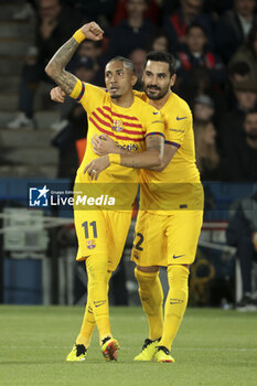 2024-04-10 - Raphinha of Barcelona celebrates his goal with Ilkay Gundogan of Barcelona during the UEFA Champions League, Quarter-finals, 1st leg football match between Paris Saint-Germain (PSG) and FC Barcelona on April 10, 2024 at Parc des Princes stadium in Paris, France - FOOTBALL - CHAMPIONS LEAGUE - PARIS SG V FC BARCELONA - UEFA CHAMPIONS LEAGUE - SOCCER