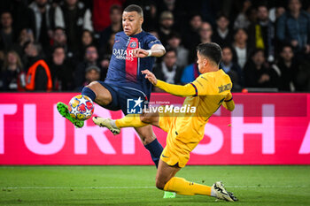 2024-04-10 - Kylian MBAPPE of PSG and Joao CANCELO of Barcelona during the UEFA Champions League, Quarter-finals, 1st leg football match between Paris Saint-Germain and FC Barcelona on April 10, 2024 at Parc des Princes stadium in Paris, France - FOOTBALL - CHAMPIONS LEAGUE - PARIS SG V FC BARCELONA - UEFA CHAMPIONS LEAGUE - SOCCER