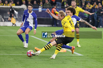 2024-04-16 - Julian Brandt of Borussia Dortmund scores a goal 1-0, Axel Witsel of Atletico Madrid during the UEFA Champions League, Quarter-finals, 2nd leg football match between Borussia Dortmund and Atletico Madrid on April 16, 2024 at Signal Iduna Park in Dortmund, Germany - FOOTBALL - CHAMPIONS LEAGUE - DORTMUND V ATLETICO MADRID - UEFA CHAMPIONS LEAGUE - SOCCER