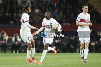 2024-04-16 - Ousmane Dembele of PSG celebrates his goal with Bradley Barcola of PSG (left) during the UEFA Champions League, Quarter-finals, 2nd leg football match between FC Barcelona and Paris Saint-Germain on April 16, 2024 at Estadi Olímpic Lluís Companys in Barcelona, Spain - FOOTBALL - CHAMPIONS LEAGUE - FC BARCELONA V PARIS SG - UEFA CHAMPIONS LEAGUE - SOCCER