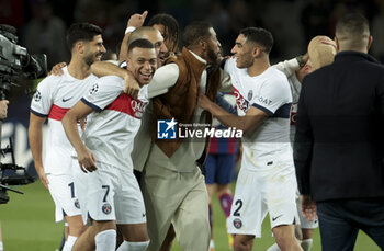 2024-04-16 - Marco Asensio, Kylian Mbappe, Presnel Kimpembe, Achraf Hakimi of PSG and teammates celebrate the victory following the UEFA Champions League, Quarter-finals, 2nd leg football match between FC Barcelona and Paris Saint-Germain (PSG) on April 16, 2024 at Estadi Olímpic Lluís Companys in Barcelona, Spain - FOOTBALL - CHAMPIONS LEAGUE - FC BARCELONA V PARIS SG - UEFA CHAMPIONS LEAGUE - SOCCER