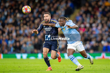 2024-04-17 - Manchester City forward Jérémy Doku (11) and Real Madrid defender Daniel Carvajal (2) during the UEFA Champions League, Quarter-finals, 2nd leg football match between Manchester City and Real Madrid on April 17, 2024 at Etihad Stadium in Manchester, England - FOOTBALL - CHAMPIONS LEAGUE - MANCHESTER CITY V REAL MADRID - UEFA CHAMPIONS LEAGUE - SOCCER