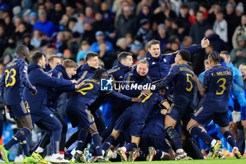 2024-04-17 - Real Madrid players celebrate the penalty shoot out victory at the end of the UEFA Champions League, Quarter-finals, 2nd leg football match between Manchester City and Real Madrid on April 17, 2024 at Etihad Stadium in Manchester, England - FOOTBALL - CHAMPIONS LEAGUE - MANCHESTER CITY V REAL MADRID - UEFA CHAMPIONS LEAGUE - SOCCER
