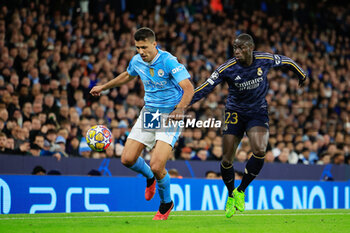 2024-04-17 - Rodrigo (16) of Manchester City and Ferland Mendy (23) of Real Madrid during the UEFA Champions League, Quarter-finals, 2nd leg football match between Manchester City and Real Madrid on April 17, 2024 at Etihad Stadium in Manchester, England - FOOTBALL - CHAMPIONS LEAGUE - MANCHESTER CITY V REAL MADRID - UEFA CHAMPIONS LEAGUE - SOCCER