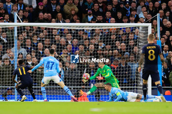 2024-04-17 - Ederson (31) of Manchester City and Rodrygo Goes (11) of Real Madrid during the UEFA Champions League, Quarter-finals, 2nd leg football match between Manchester City and Real Madrid on April 17, 2024 at Etihad Stadium in Manchester, England - FOOTBALL - CHAMPIONS LEAGUE - MANCHESTER CITY V REAL MADRID - UEFA CHAMPIONS LEAGUE - SOCCER