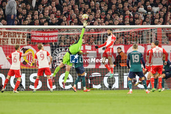 2024-04-17 - Manuel Neuer of Bayern Munich makes a save during the UEFA Champions League, Quarter-finals, 2nd leg football match between Bayern Munich and Arsenal on April 17, 2024 at Allianz Arena in Munich, Germany - FOOTBALL - CHAMPIONS LEAGUE - BAYERN MUNICH V ARSENAL - UEFA CHAMPIONS LEAGUE - SOCCER