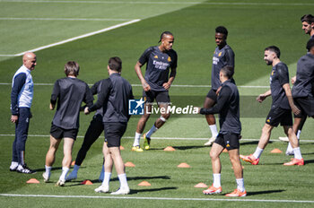 2024-05-07 - MADRID, SPAIN - MAY 7: Eder Militao of Real Madrid (C) warms up with his teammates during Real Madrid Training Session and Press Conference ahead of their UEFA Champions League semi-final second leg match against FC Bayern Munchen at Ciudad Real Madrid on May 7, 2024 in Valdebebas, Spain. - REAL MADRID VS BAYERN MUNICH: REAL MADRID PRESS CONFERENCE AND TRAINING SESSION - UEFA CHAMPIONS LEAGUE - SOCCER