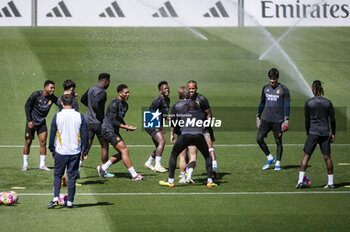 2024-05-07 - MADRID, SPAIN - MAY 7: Real Madrid players (from L to R) Jude Bellingham, Vinicius Junior, Rodrygo Silva de Goes, Luka Modric warms up during Real Madrid Training Session and Press Conference ahead of their UEFA Champions League semi-final second leg match against FC Bayern Munchen at Ciudad Real Madrid on May 7, 2024 in Valdebebas, Spain. - REAL MADRID VS BAYERN MUNICH: REAL MADRID PRESS CONFERENCE AND TRAINING SESSION - UEFA CHAMPIONS LEAGUE - SOCCER